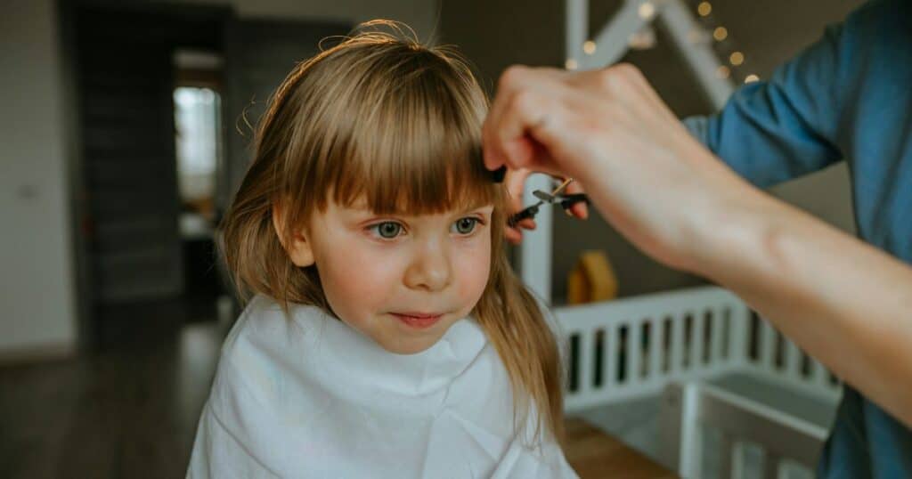 Toddler getting a haircut at a sensory-friendly salon